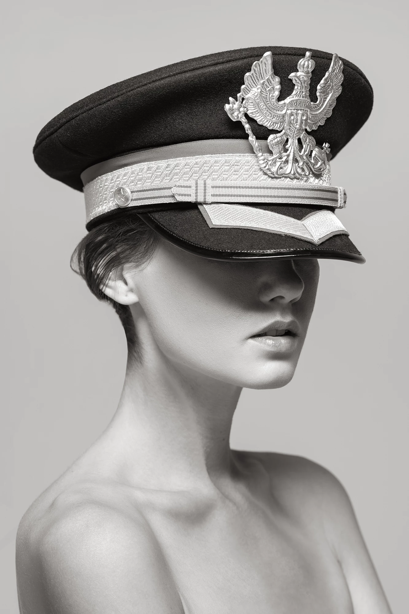 art photograph of a woman wearing an oversized hat